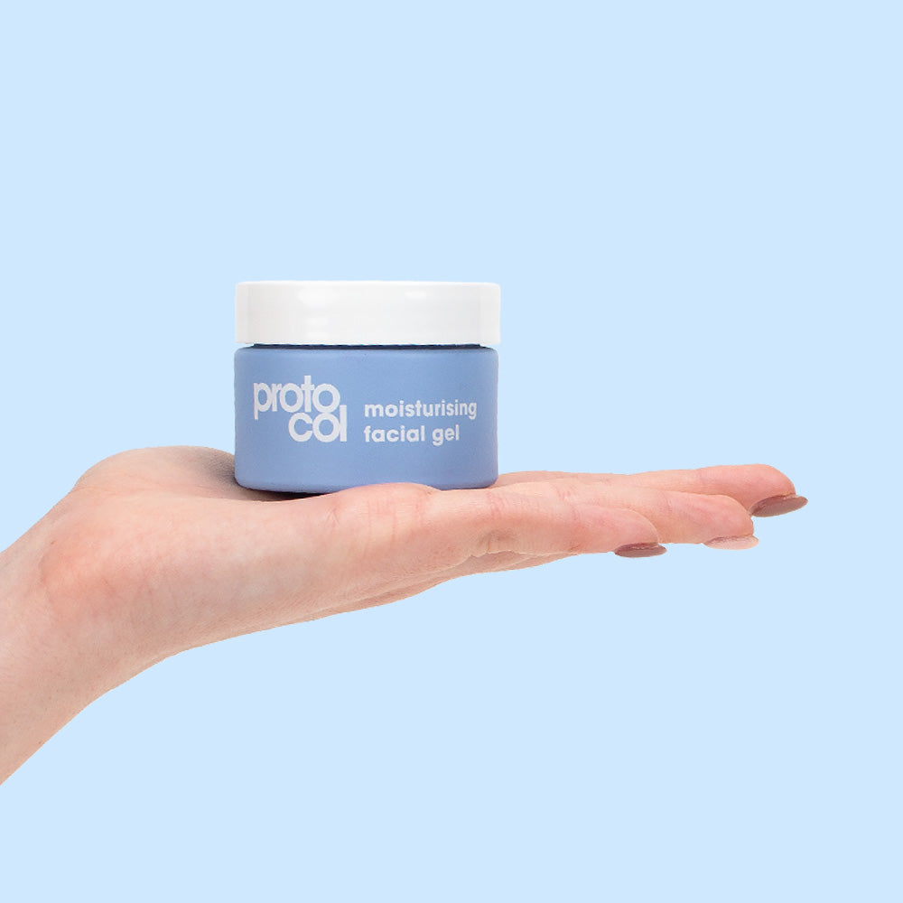 Hand holding a pot of Moisturising Facial Gel flat on the palm