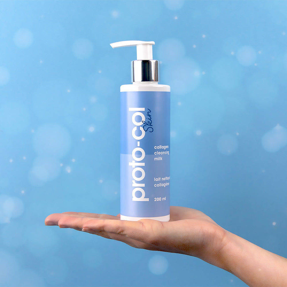 Hand holding the Collagen Cleansing Milk flat on their palm.